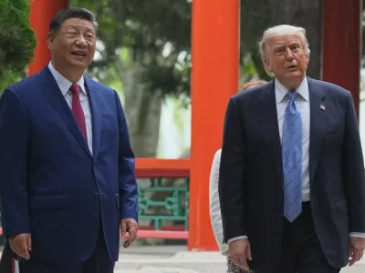 President Donald Trump talks with China's President Xi Jinping at the Zhongnanhai leadership compound, Friday, May 15, 2026, in Beijing. (AP Photo/Mark Schiefelbein, Pool)