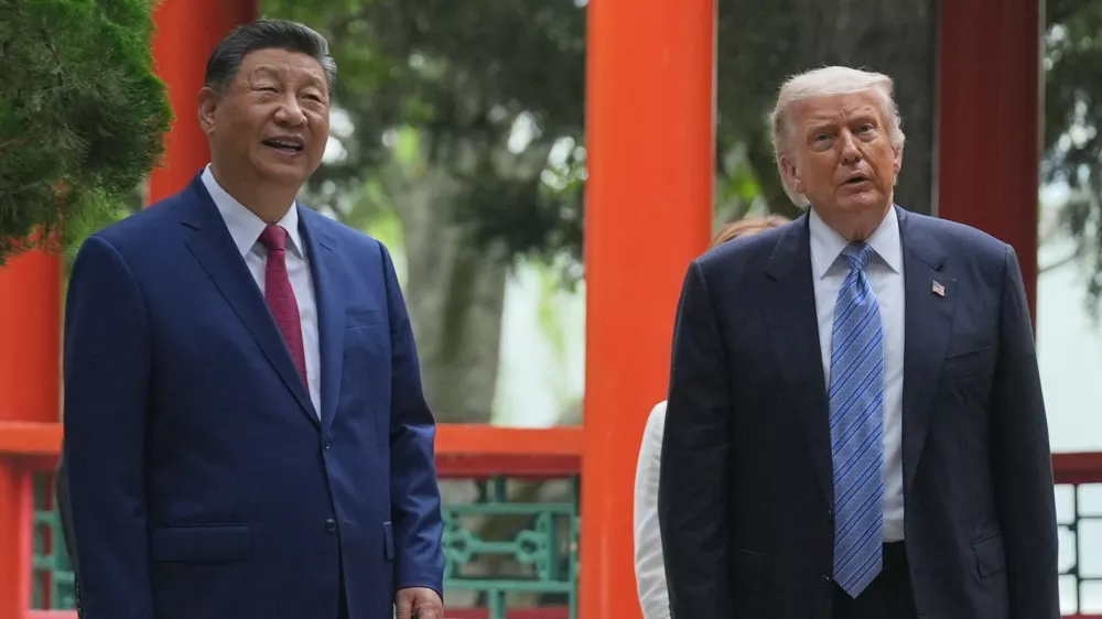 President Donald Trump talks with China's President Xi Jinping at the Zhongnanhai leadership compound, Friday, May 15, 2026, in Beijing. (AP Photo/Mark Schiefelbein, Pool)
