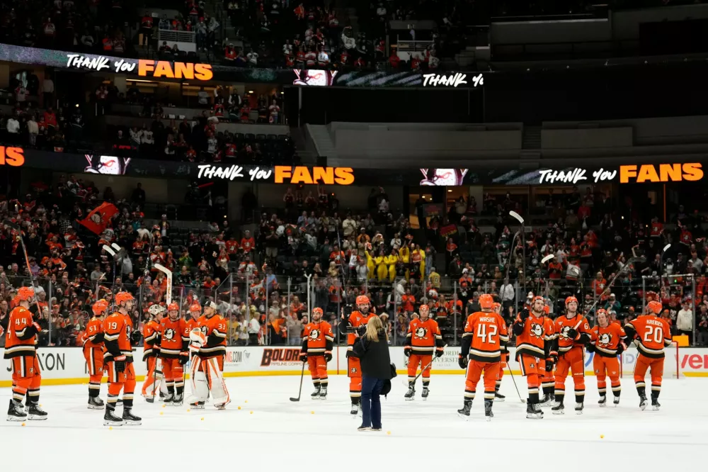Members of the Anaheim Ducks acknowledge fans after they were seated by the Vegas Golden Knights in Game 6 of a second-round NHL hockey Stanley Cup playoff series Thursday, May 14, 2026, in Anaheim, Calif. (AP Photo/Mark J. Terrill)