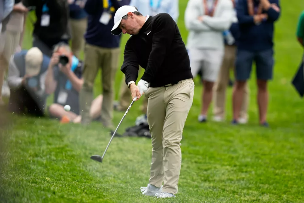Rory McIlroy, of Northern Ireland, hits from the rough on the ninth hole during the first round of the PGA Championship golf tournament practice round at Aronimink Golf Club, Thursday, May 14, 2026, in Newtown Square, PA. (AP Photo/Frank Franklin II)