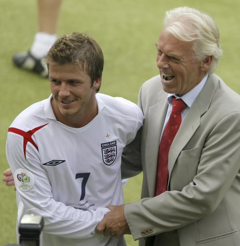 FILE - England's David Beckham shakes hands with Trinidad and Tobago's coach Leo Beenhakker, right, during their World Cup Group B soccer match in Nuremberg, Germany, Thursday, June 15, 2006. (AP Photo/Ivan Sekretarev, File) 