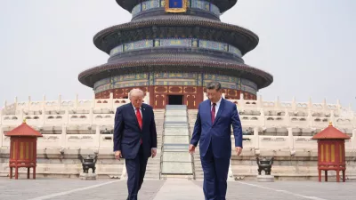 President Donald Trump, left, walks with Chinese President Xi Jinping at the Temple of Heaven on Thursday May 14, 2026, in Beijing. (AP Photo/Mark Schiefelbein)