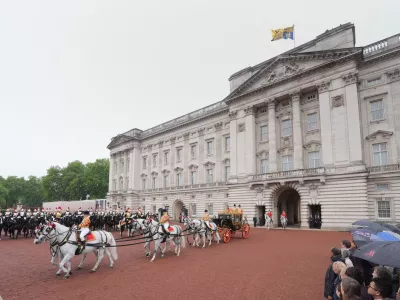 Britain's King Charles III and Queen Camilla travel in the Irish State Coach as they depart Buckingham Palace, London, to attend the State Opening of Parliament in the House of Lords, in London, Wednesday May 13, 2026. (Yui Mok/Pool Photo via AP)