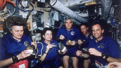 March 1996: NASA's STS-76 Atlantis Space Shuttle crew enjoying a meal aboard Russia's MIR Space Station. Their mission is part of the first phase of the International Space Program combining multinational efforts in a quest to establish a permanently-manned orbiting space laboratory. From left - mission specialists Shannon Lucid, Linda Godwin, and Michael Clifford, Pilot Richard Searfoss and commander Kevin Chilton. (Photo by Space Frontiers/Space Frontiers/Getty Images)