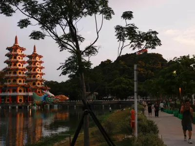 People walk past the Dragon and Tiger Pagodas at Lotus Pond in Kaohsiung, Taiwan, May 15, 2026. REUTERS/Ann Wang