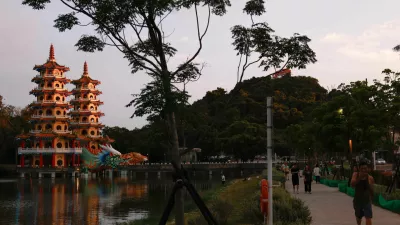 People walk past the Dragon and Tiger Pagodas at Lotus Pond in Kaohsiung, Taiwan, May 15, 2026. REUTERS/Ann Wang