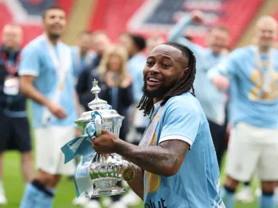 Manchester City's Antoine Semenyo holds the winner's trophy after the English FA Cup final soccer match between Chelsea and Manchester City in London, Saturday, May 16, 2026. (AP Photo/Richard Pelham)