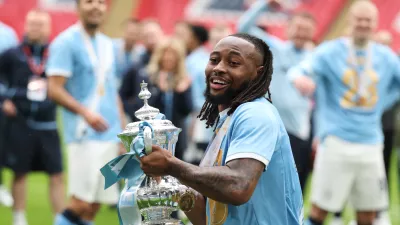 Manchester City's Antoine Semenyo holds the winner's trophy after the English FA Cup final soccer match between Chelsea and Manchester City in London, Saturday, May 16, 2026. (AP Photo/Richard Pelham)