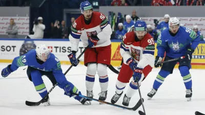 Ice Hockey - IIHF World Championships - Group B - Slovenia v Czech Republic - BCF Arena, Fribourg, Switzerland - May 16, 2026 Czech Republic's Daniel Vozenilek and David Tomasek in action with Slovenia's Filip Sitar REUTERS/David W Cerny