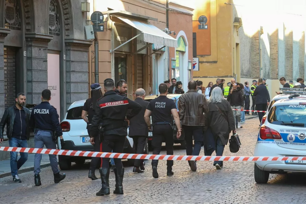 Police officers work at the scene after several people were injured when a car drove into pedestrians in the center of the northern Italian city of Modena, Italy, May 16, 2026. REUTERS/Stringer