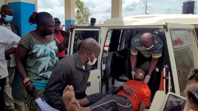 FILE PHOTO: A man is carried from an ambulance as he arrives at Bunia General Referral Hospital following confirmation of an Ebola outbreak involving the Bundibugyo strain in Bunia, Ituri province, Democratic Republic of Congo, May 16, 2026. REUTERS/Victoire Mukenge/File Photo