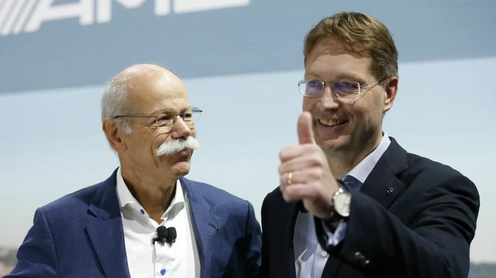 Ola Kallenius, right, member of the Board of Management of Daimler AG. Group Research & Mercedes-Benz Cars Development, gives a thumbs-up as Dieter Zetsche, Chairman of the Board of Management of Daimler AG, Head of Mercedes-Benz Cars, looks on during a media preview at the Auto show in Paris, France, Tuesday, Oct. 2, 2018, 2018. (AP Photo/Thibault Camus)