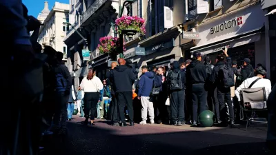 People queue outside a Swatch store to buy a limited-edition "Royal Pop" watch, a collaboration between Audemars Piguet and Swatch, in Cannes, France, May 16, 2026. REUTERS/Manon Cruz
