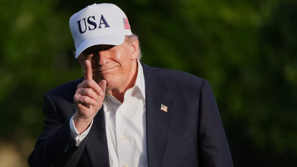 President Donald Trump walks across the South Lawn of the White House, Friday, May 15, 2026, in Washington, on return from Beijing where he met with China's President Xi Jinping. (AP Photo/Jacquelyn Martin)