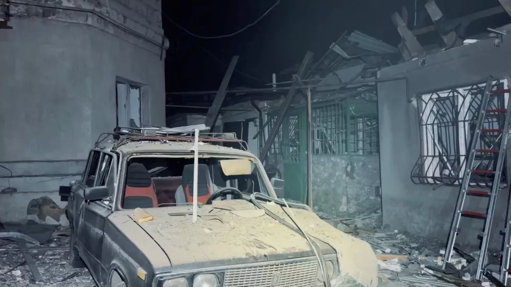 A destroyed car and damaged buildings at the site of a Russian drone strike, amid Russia's attack on Ukraine, in a location given as Odesa, Ukraine, in this screengrab obtained from a handout video released on May 18, 2026. Odesa City Council via Telegram/Handout via REUTERS  THIS IMAGE HAS BEEN SUPPLIED BY A THIRD PARTY. MANDATORY CREDIT. NO RESALES. NO ARCHIVES.  VERIFICATION - Location in the parts of the video and date could not be verified. - However, no earlier version of the footage was posted online before May 18.