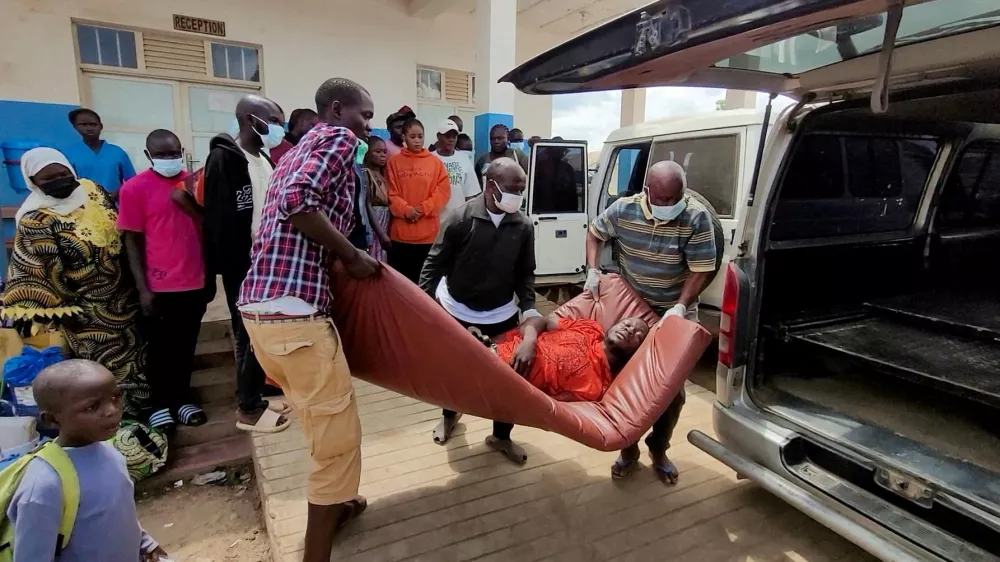A man is carried from an ambulance as he arrives at Bunia General Referral Hospital following confirmation of an Ebola outbreak involving the Bundibugyo strain in Bunia, Ituri province, Democratic Republic of Congo, May 16, 2026. Picture taken with a mobile phone. REUTERS/Victoire Mukenge