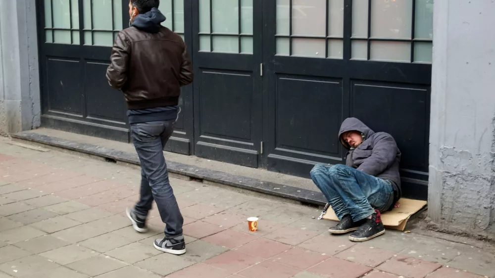 Homeless man asleep in the street in Brussels, Belgium,Image: 160166869, License: Rights-managed, Restrictions:, Model Release: no 