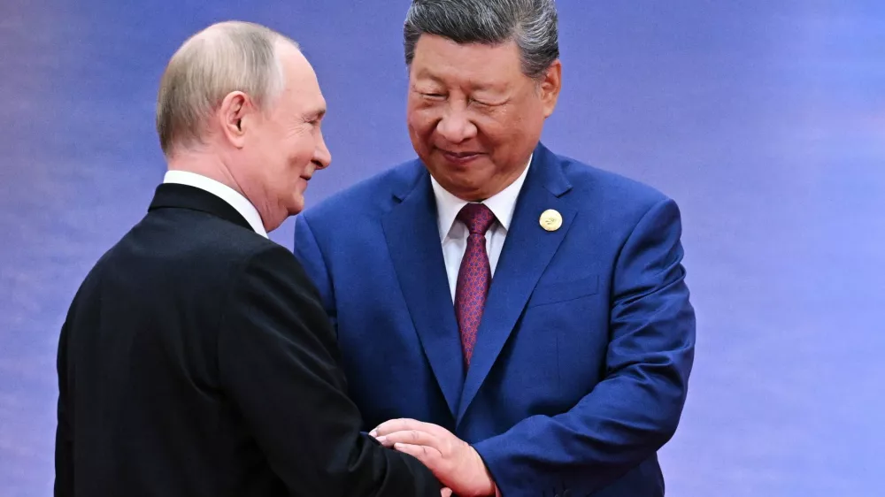 FILE - Russian President Vladimir Putin, left, and Chinese President Xi Jinping greet each other in Tianjin, China, on Aug. 31, 2025. (Sergei Bobylev, Sputnik, Kremlin Pool Photo via AP, File)