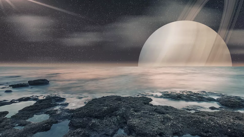 Pogled na Saturn s Titana, kot si ga je predstavljal umetnik. / Foto: Istock