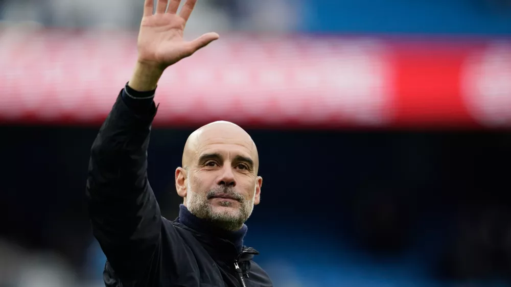 FILE - Manchester City's head coach Pep Guardiola greets fans at the end of the English Premier League soccer match between Manchester City and Brentford in Manchester, Saturday, May 9, 2026. (AP Photo/Dave Thompson, File)