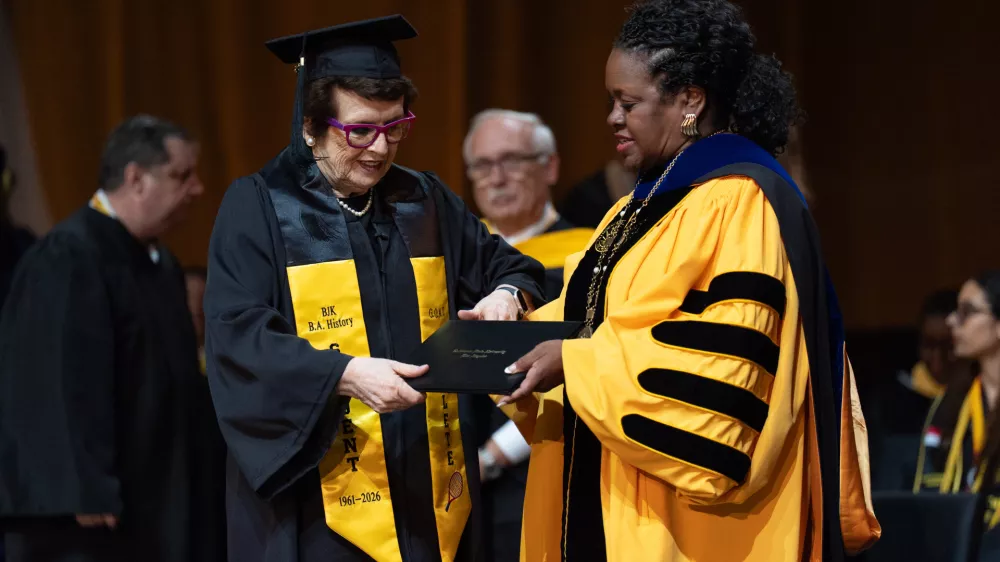 Tennis legend Billie Jean King, left, receives her diploma from California State University, Los Angeles, President Berenecea Johnson Eanes during commencement in Los Angeles, Monday, May 18, 2026. (AP Photo/Jae C. Hong)