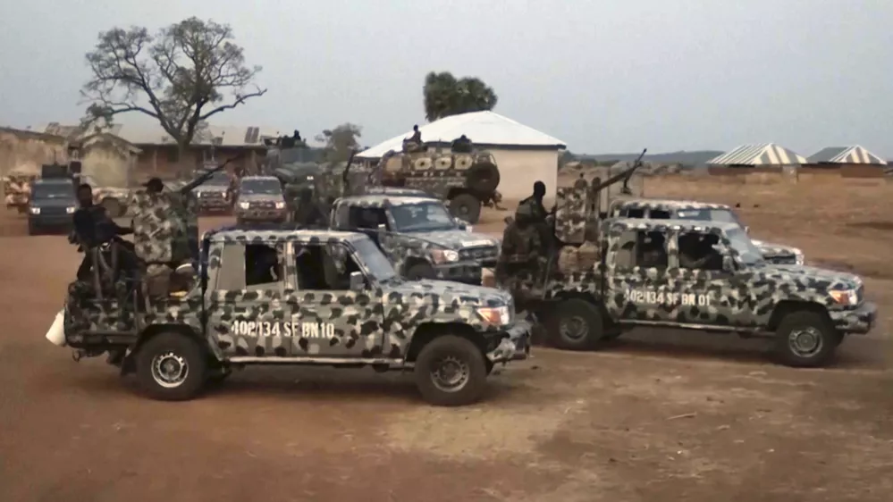 In this screen grab taken from video, Nigerian Army vehicles are parked at the village were children were kidnapped in Kuriga, Kaduna State, Thursday, March. 7, 2024. Gunmen attacked a school in Nigeria's northwest region Thursday morning and abducted at least 287 students, the headteacher told authorities, marking the second mass abduction in the West African nation in less than a week. (AP Video)