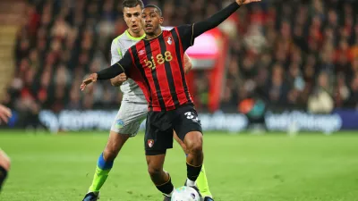 Manchester City's Rodrigo, left, challenges for the ball with Bournemouth's Rayan during the English Premier League soccer match between AFC Bournemouth and Manchester City in Bournemouth, England, Tuesday, May 19, 2026. (AP Photo/Ian Walton)