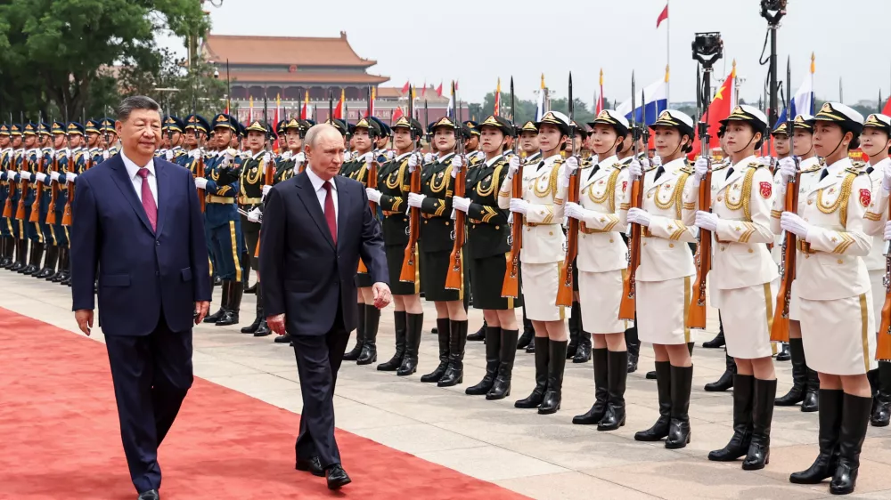 Russian President Vladimir Putin, right, and Chinese President Xi Jinping inspect an honor guard during a welcoming ceremony at the Great Hall of the People, in Beijing, China, on Wednesday, May 20, 2026. (Alexander Kazakov, Sputnik, Kremlin Pool Photo via AP)