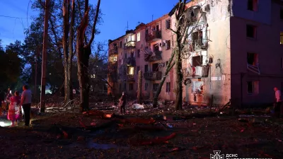 Residents stand at the site of an apartment building damaged during Russian drone and missile strikes, amid Russia's attack on Ukraine, in Dnipro, Ukraine May 18, 2026. Press service of the State Emergency Service of Ukraine in Dnipropetrovsk region/Handout via REUTERS ATTENTION EDITORS - THIS IMAGE HAS BEEN SUPPLIED BY A THIRD PARTY. DO NOT OBSCURE LOGO.