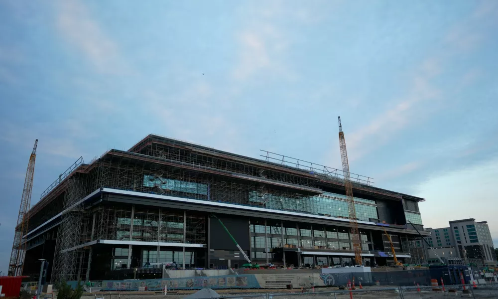 FILE - Construction continues on a new enclosed stadium for the Tennessee Titans NFL football team Monday, May 18, 2026, in Nashville, Tenn. (AP Photo/George Walker IV, File)