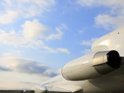 White passenger airplane, view with behind