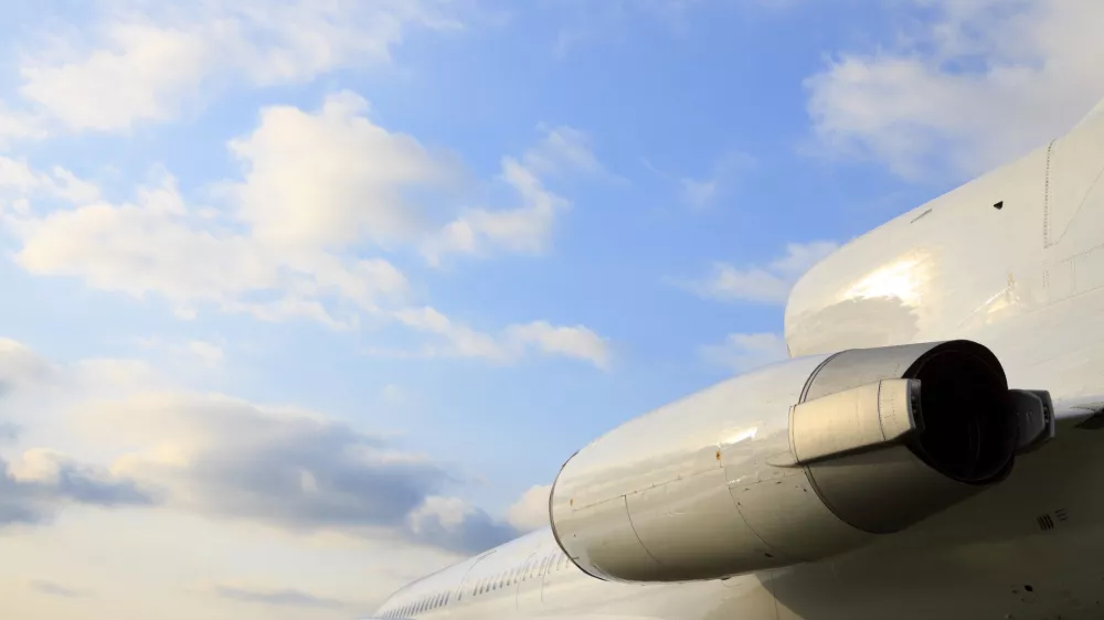 White passenger airplane, view with behind