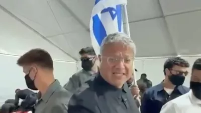 Israeli National Security Minister Itamar Ben Gvir reacts as flotilla activists are detained by Israeli forces, in Ashdod Port, Israel, in this screen grab taken from a video released on May 20, 2026. Office Of Itamar Ben Gvir/Handout via REUTERS  THIS IMAGE HAS BEEN SUPPLIED BY A THIRD PARTY MANDATORY CREDIT VERIFICATION LINES: - Deck structure, bridge, stairs and container of the ship seen in video matched Reuters footage of an Israeli vessel arriving in Ashdod port on May 20 and reportedly carrying activists - Buildings and tent structures matched archive imagery of the Ashdod port and corroborating visuals - Identity of all the detained people could not be independently verified; however Reuters confirmed that some of them were part of the Global Sumud Flotilla by hair and facial features which matched visuals posted on social media by the activists  - Exact date could not verified, but no older version of the video was found posted online before May 20