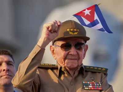 FILE - Raul Castro waves a Cuban national flag during a May Day parade at Revolution Square in Havana, May 1, 2025. (AP Photo/Ramon Espinosa, File)