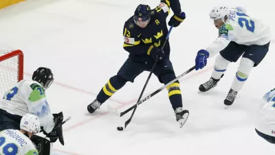 Ice Hockey - IIHF World Championships - Group B - Sweden v Slovenia - BCF Arena, Fribourg, Switzerland - May 20, 2026 Sweden's Lucas Raymond in action with Slovenia's Maks Percic REUTERS/David W Cerny