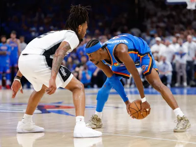May 20, 2026; Oklahoma City, Oklahoma, USA; Oklahoma City Thunder guard Shai Gilgeous-Alexander (2) looks to pass as San Antonio Spurs guard Stephon Castle (5) defends during the fourth quarter during game two of the western conference finals for the 2026 NBA playoffs at Paycom Center. Mandatory Credit: Alonzo Adams-Imagn Images