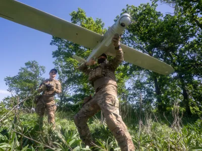 Ukrainian servicemen of Khartia brigade launch a drone towards Russian positions at the front line in the Kharkiv region, Ukraine, Wednesday, May 20, 2026. (AP Photo/Andrii Marienko)