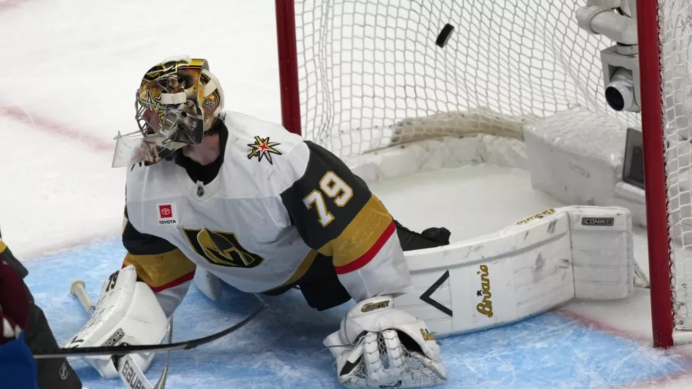 Vegas Golden Knights goaltender Carter Hart allows a goal off the stick of Colorado Avalanche left wing Gabriel Landeskog during the third period in Game 1 of the Western Conference finals NHL hockey Stanley Cup playoff series Wednesday, May 20, 2026, in Denver. (AP Photo/David Zalubowski)