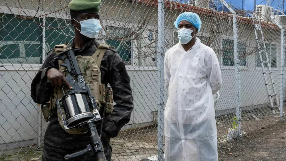 A member of the M23 rebel group stands guard outside a laboratory where samples from suspected Ebola cases are tested, in Goma, Democratic Republic of Congo, May 19. REUTERS/Arlette Bashizi Purchase Licensing Rights, opens new tab