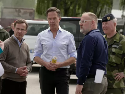 NATO Secretary General Mark Rutte and Swedish Prime Minister Ulf Kristersson look at a civil alarm system during a visit to Revinge, Sweden, May 21, 2026. REUTERS/Tom Little