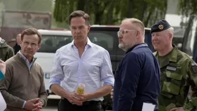 NATO Secretary General Mark Rutte and Swedish Prime Minister Ulf Kristersson look at a civil alarm system during a visit to Revinge, Sweden, May 21, 2026. REUTERS/Tom Little