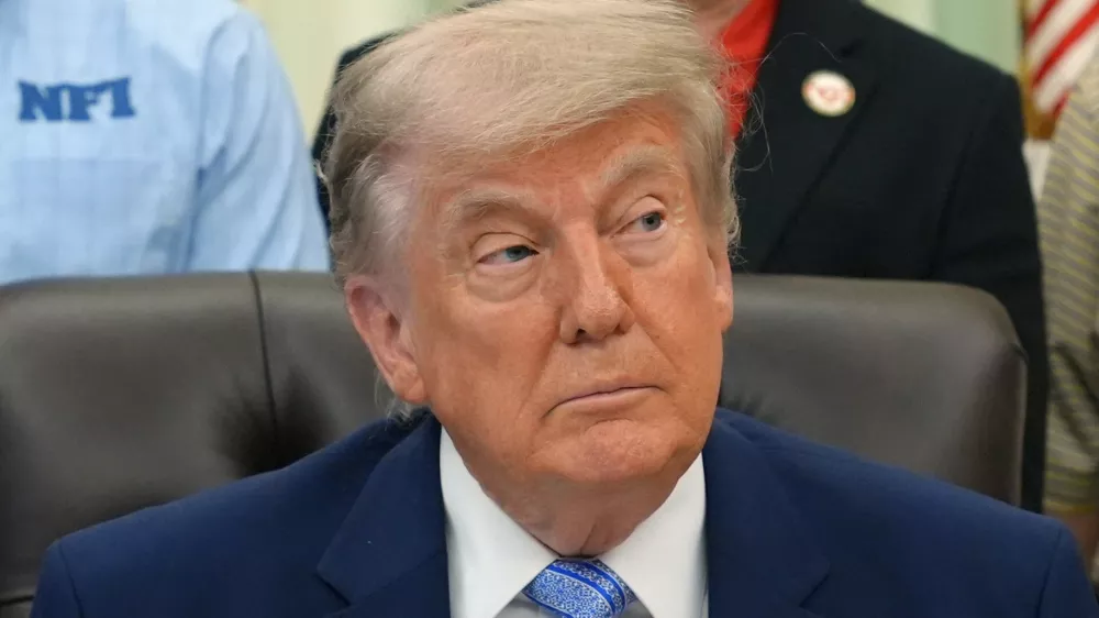 President Donald Trump attends an event about loosening a federal refrigerant rule, in the Oval Office at the White House, Thursday, May 21, 2026, in Washington. (AP Photo/Jacquelyn Martin)
