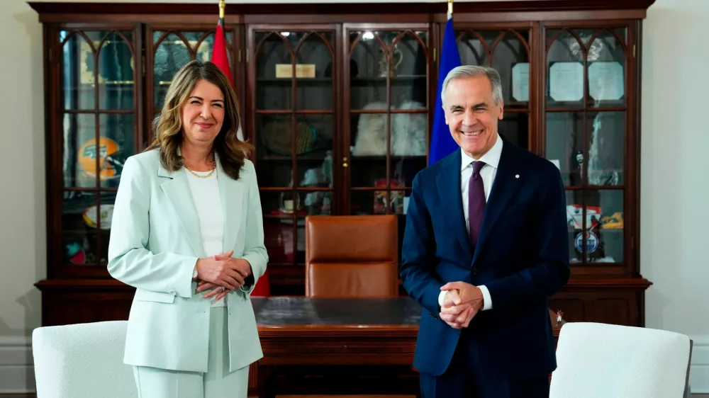 FILE - Prime Minister Mark Carney, right, meets with Premier of Alberta Danielle Smith at his office in Ottawa on Friday, May 8, 2026. (Sean Kilpatrick/The Canadian Press via AP, File)
