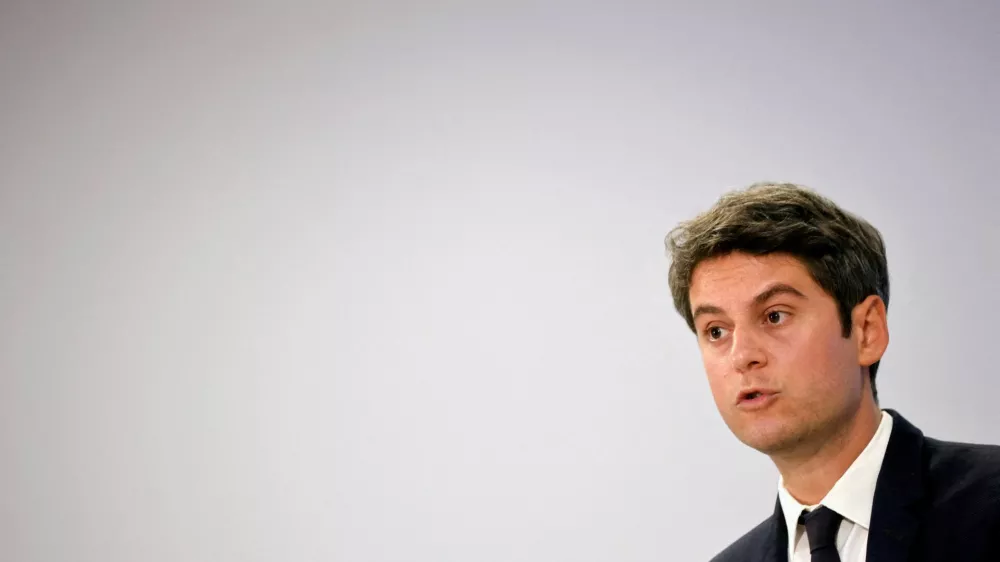 FILE PHOTO: French Prime Minister Gabriel Attal speaks during a press conference entitled "The day after" to talk about the key measures in his party's programme for the hundred days after the upcoming French parliamentary elections, at the headquarters of the presidential majority group "Ensemble pour la Republique" in Paris, France, June 20, 2024. REUTERS/Johanna Geron/File Photo