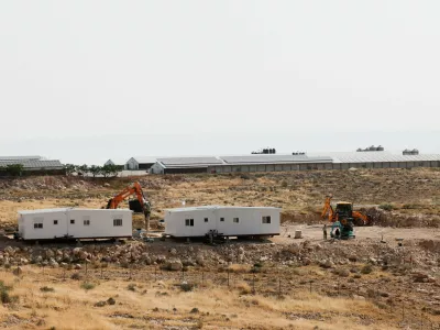 Israeli settlers install a new caravan near the Palestinian village of Um Al-Khair in Masafer Yatta in the Israeli-occupied West Bank, May 20, 2026. REUTERS/Mussa Qawasma