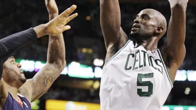 Boston Celtics power forward Kevin Garnett (5) shoots over Atlanta Hawks power forward Josh Smith (5) during the first half of Game 6 in a first-round NBA basketball playoff series in Boston, Thursday, May 10, 2012. The Celtics won 83-80 and won the series 4-2 to advance to the second round. (AP Photo/Charles Krupa)