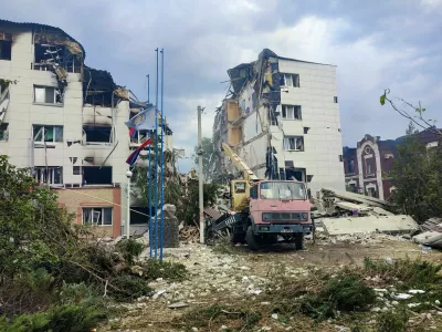 Rescuers work amid debris of a destroyed dormitory building of the Starobilsk College of Luhansk Pedagogical University following an overnight attack, what Russian-installed authorities called a Ukrainian drone strike, in the course of the Russia-Ukraine conflict in the town of Starobilsk (Starobelsk) in the Luhansk region, a Russian-controlled area of Ukraine, May 22, 2026. Picture taken with a mobile phone. REUTERS/Pavel Klimov