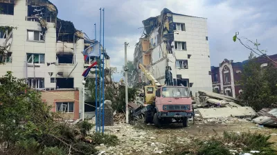 Rescuers work amid debris of a destroyed dormitory building of the Starobilsk College of Luhansk Pedagogical University following an overnight attack, what Russian-installed authorities called a Ukrainian drone strike, in the course of the Russia-Ukraine conflict in the town of Starobilsk (Starobelsk) in the Luhansk region, a Russian-controlled area of Ukraine, May 22, 2026. Picture taken with a mobile phone. REUTERS/Pavel Klimov