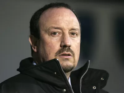 ** FILE ** Liverpool's manager Rafael Benitez looks out from the dug-out before the start of their English Premier League soccer match against Portsmouth at Fratton Park, Portsmouth, England, Saturday, Feb. 7, 2009. Benitez has signed a new contract, keeping him at the Premier League club until 2014 it was announced Wednesday March 18 2009.  The announcement ends the uncertainty about the Spaniard's future, which heightened in January after he rejected an initial deal that was offered to him by the club's American owners.(AP Photo/Sang Tan, file) ** NO INTERNET/MOBILE USAGE WITHOUT FOOTBALL ASSOCIATION PREMIER LEAGUE (FAPL) LICENCE - CALL +44 (0)20 7864 9121 or EMAIL info@football-dataco.com FOR DETAILS **