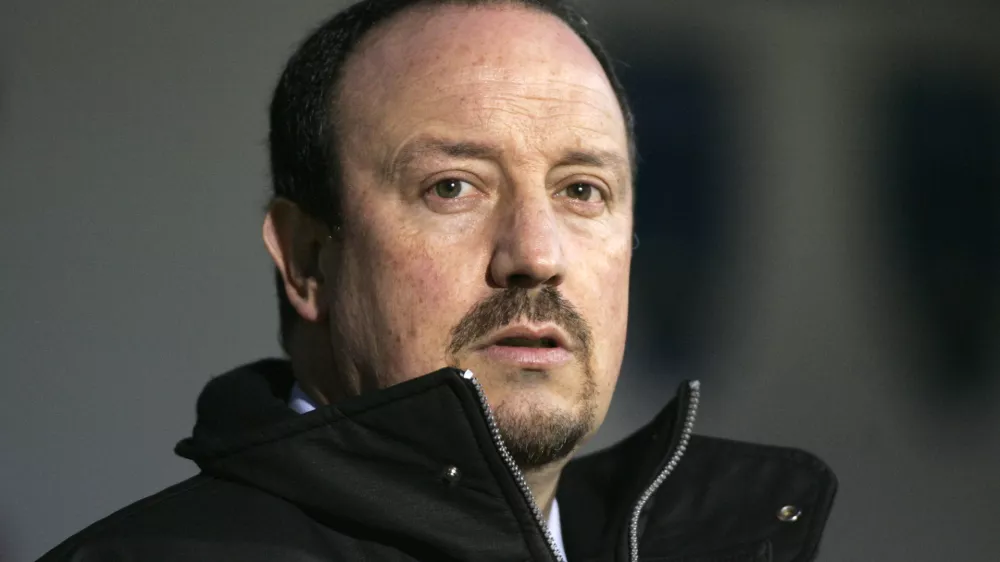 ** FILE ** Liverpool's manager Rafael Benitez looks out from the dug-out before the start of their English Premier League soccer match against Portsmouth at Fratton Park, Portsmouth, England, Saturday, Feb. 7, 2009. Benitez has signed a new contract, keeping him at the Premier League club until 2014 it was announced Wednesday March 18 2009.  The announcement ends the uncertainty about the Spaniard's future, which heightened in January after he rejected an initial deal that was offered to him by the club's American owners.(AP Photo/Sang Tan, file) ** NO INTERNET/MOBILE USAGE WITHOUT FOOTBALL ASSOCIATION PREMIER LEAGUE (FAPL) LICENCE - CALL +44 (0)20 7864 9121 or EMAIL info@football-dataco.com FOR DETAILS **